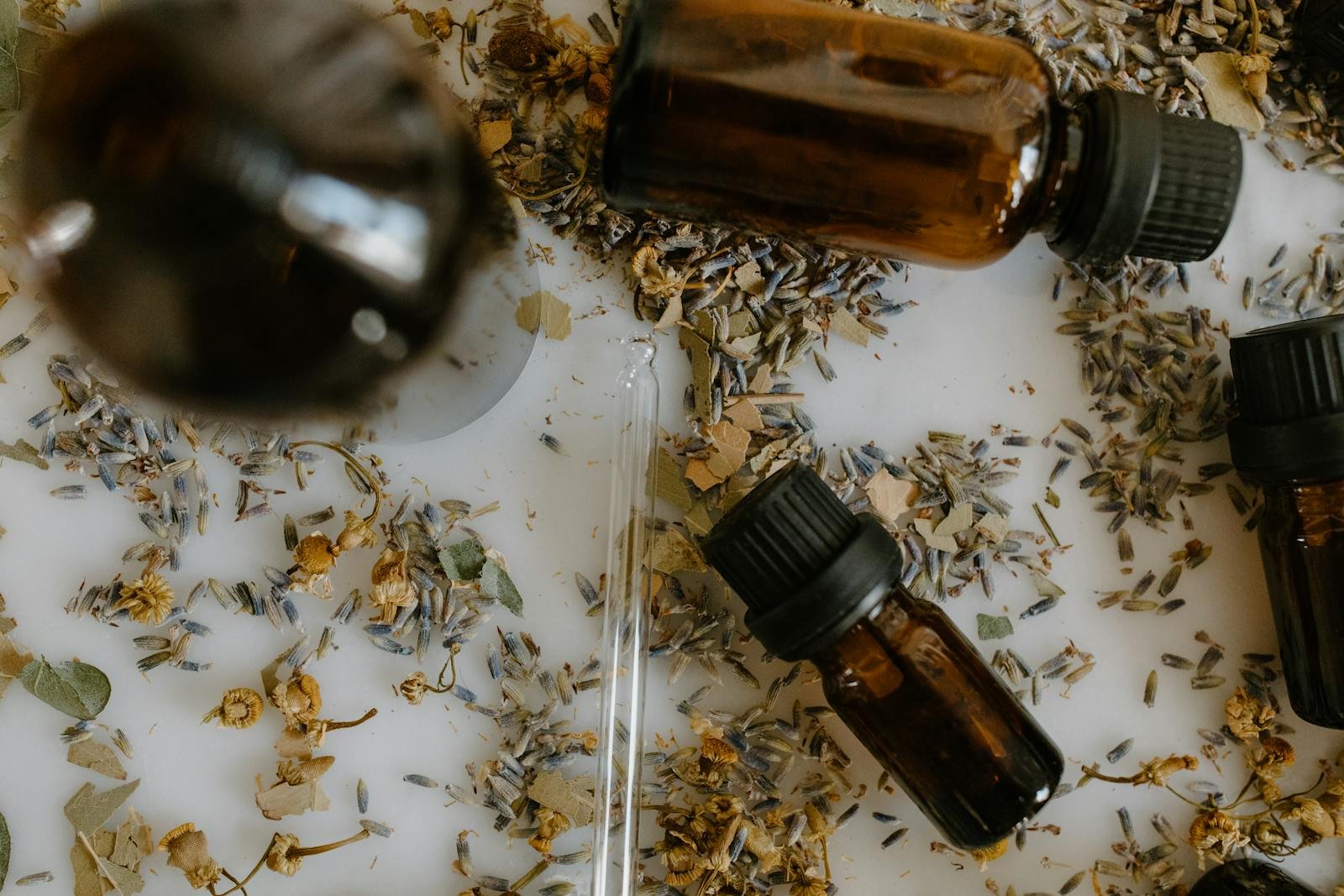 Ayurvedic herbs, oils, and natural wellness textures